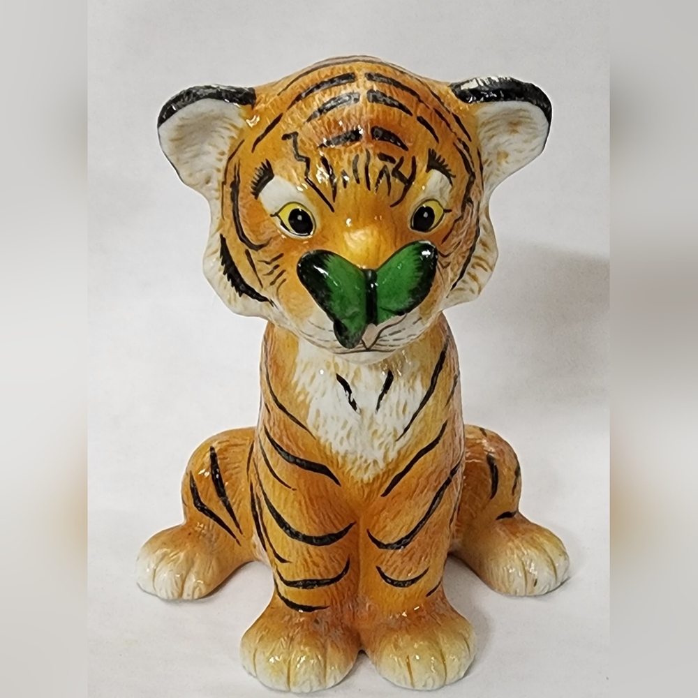 Ceramic tiger with butterfly on nose